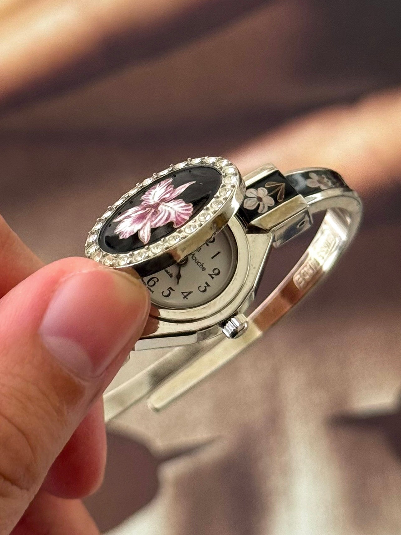 Vintage Silver Tone André Mouche Peekaboo Cuff Watch With a Black Enamel Purple Hibiscus Flower Design and Crystal Bezel