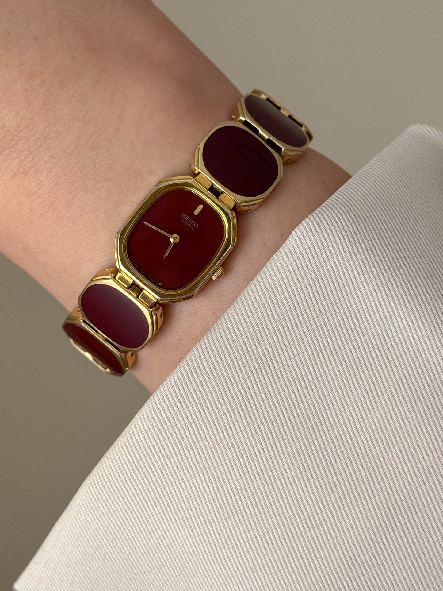 Extremely Rare and Gorgeous Seiko Watch With Deep Burgundy Tone Enamel and Gold Accents.