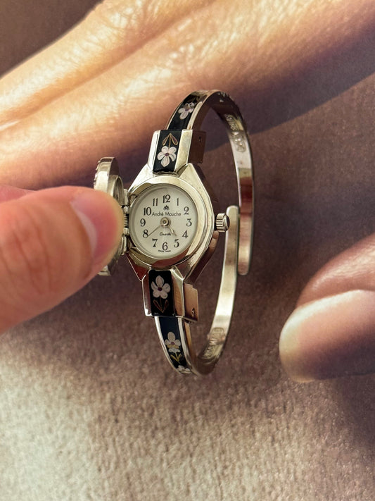 Vintage Silver Tone André Mouche Peekaboo Cuff Watch With a Black Enamel Purple Hibiscus Flower Design and Crystal Bezel