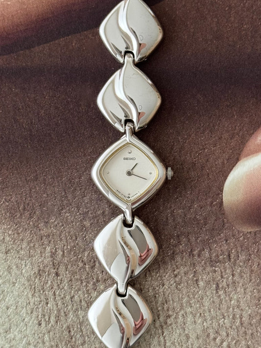 Vintage Silver Seiko Watch With Diamond Shaped Case and Polished Band