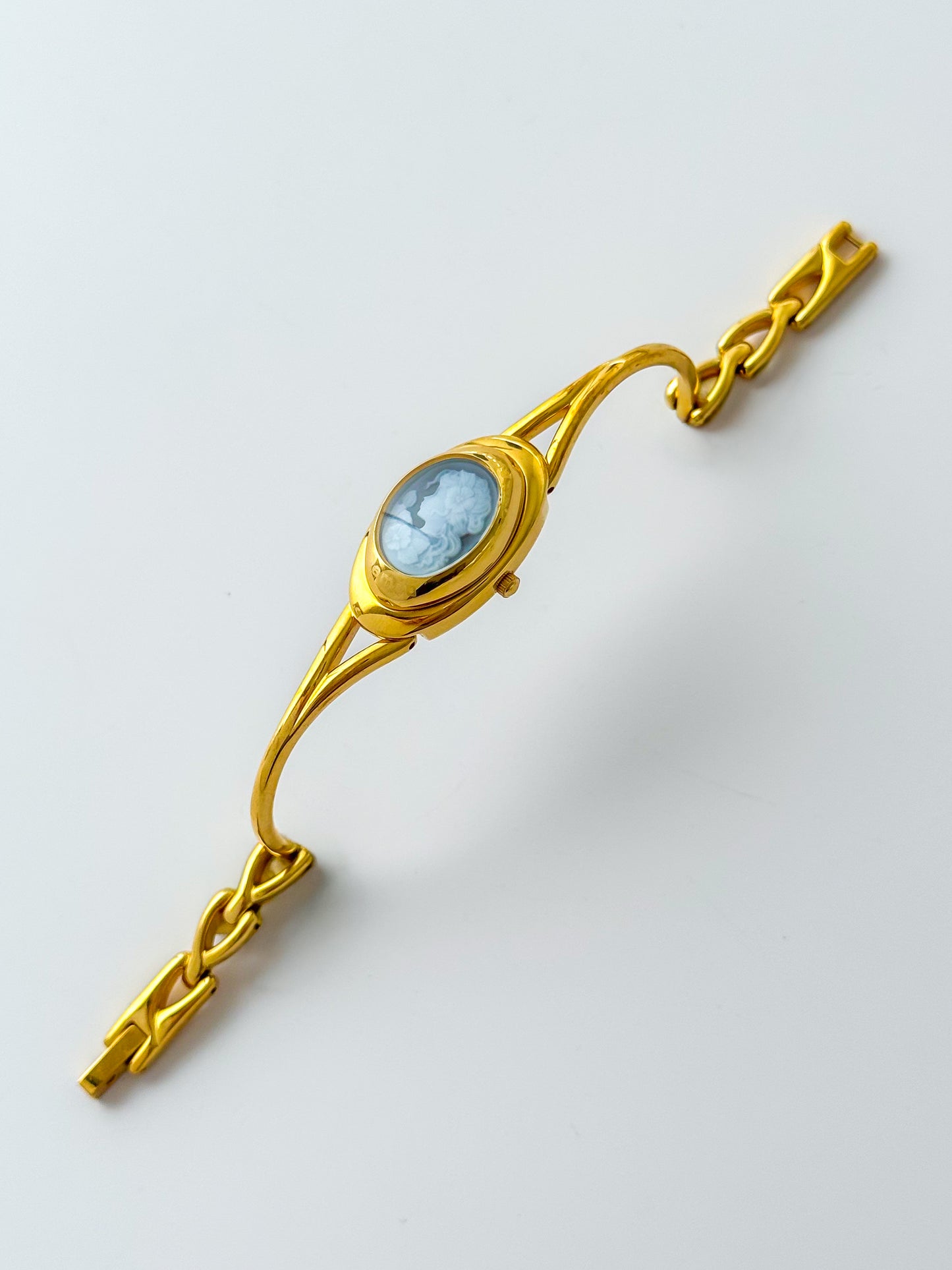 Rare Vintage Gold Tone Bangle Watch With A Blue Cameo Peekaboo Dial