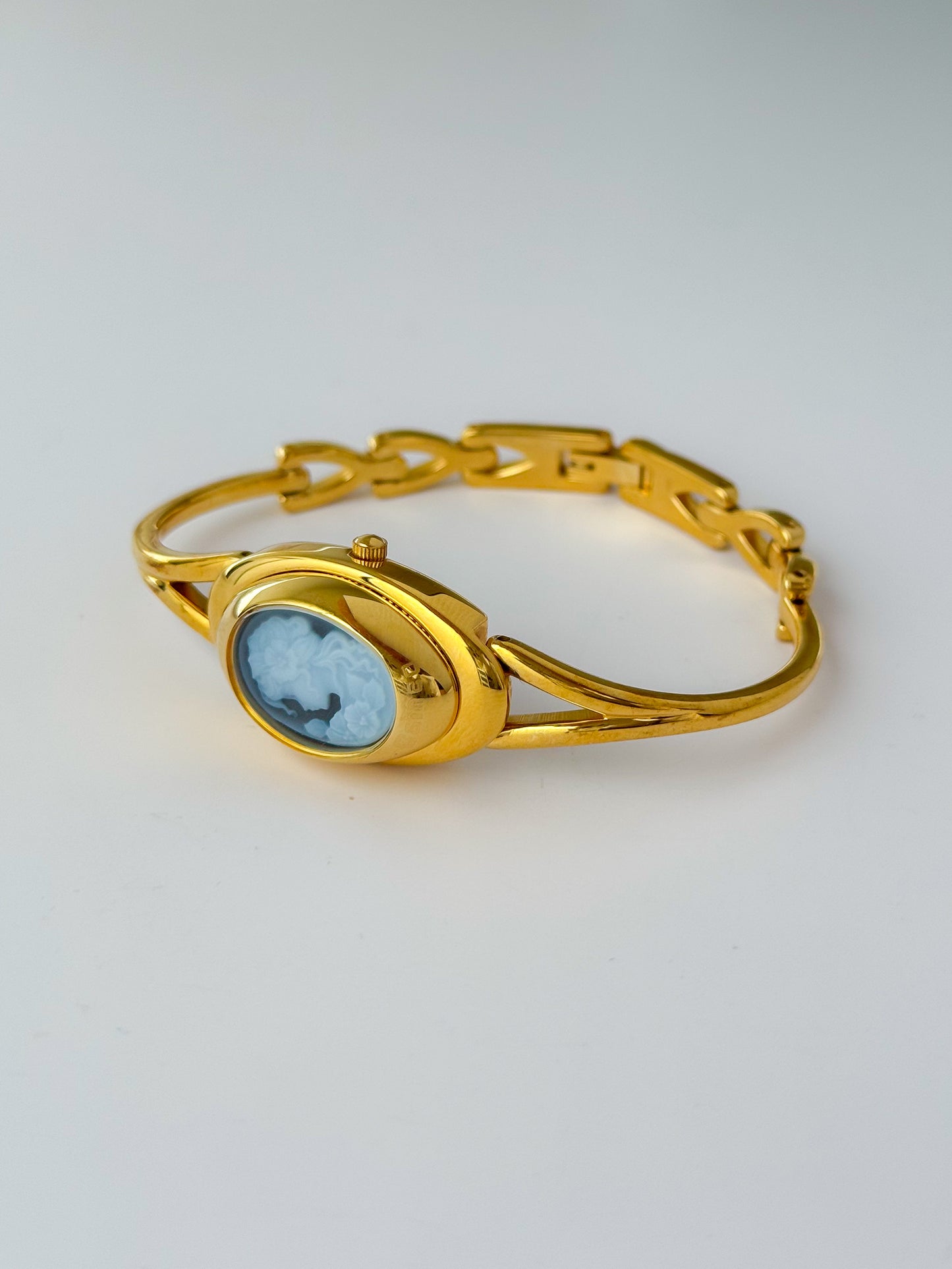 Rare Vintage Gold Tone Bangle Watch With A Blue Cameo Peekaboo Dial
