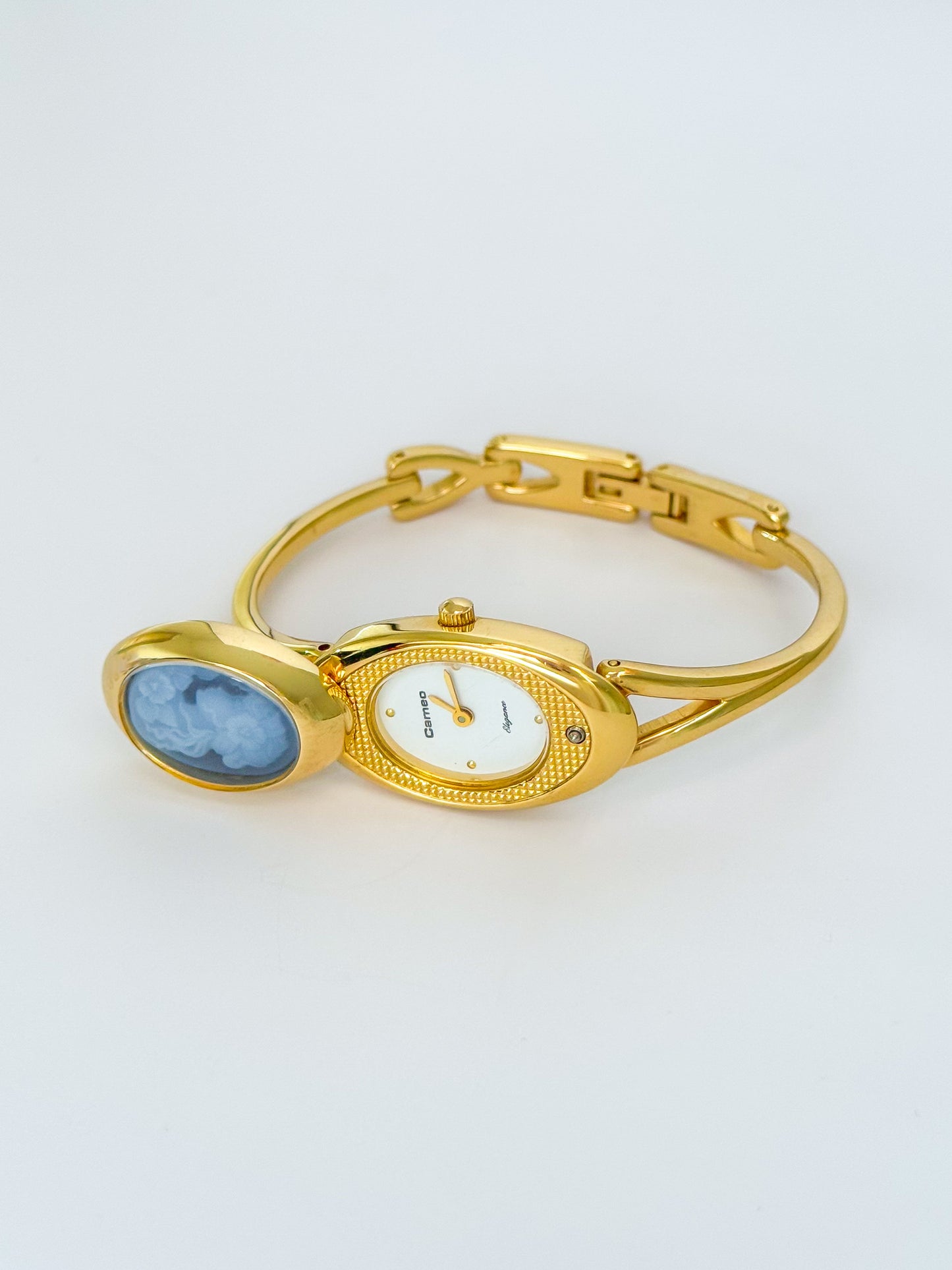 Rare Vintage Gold Tone Bangle Watch With A Blue Cameo Peekaboo Dial