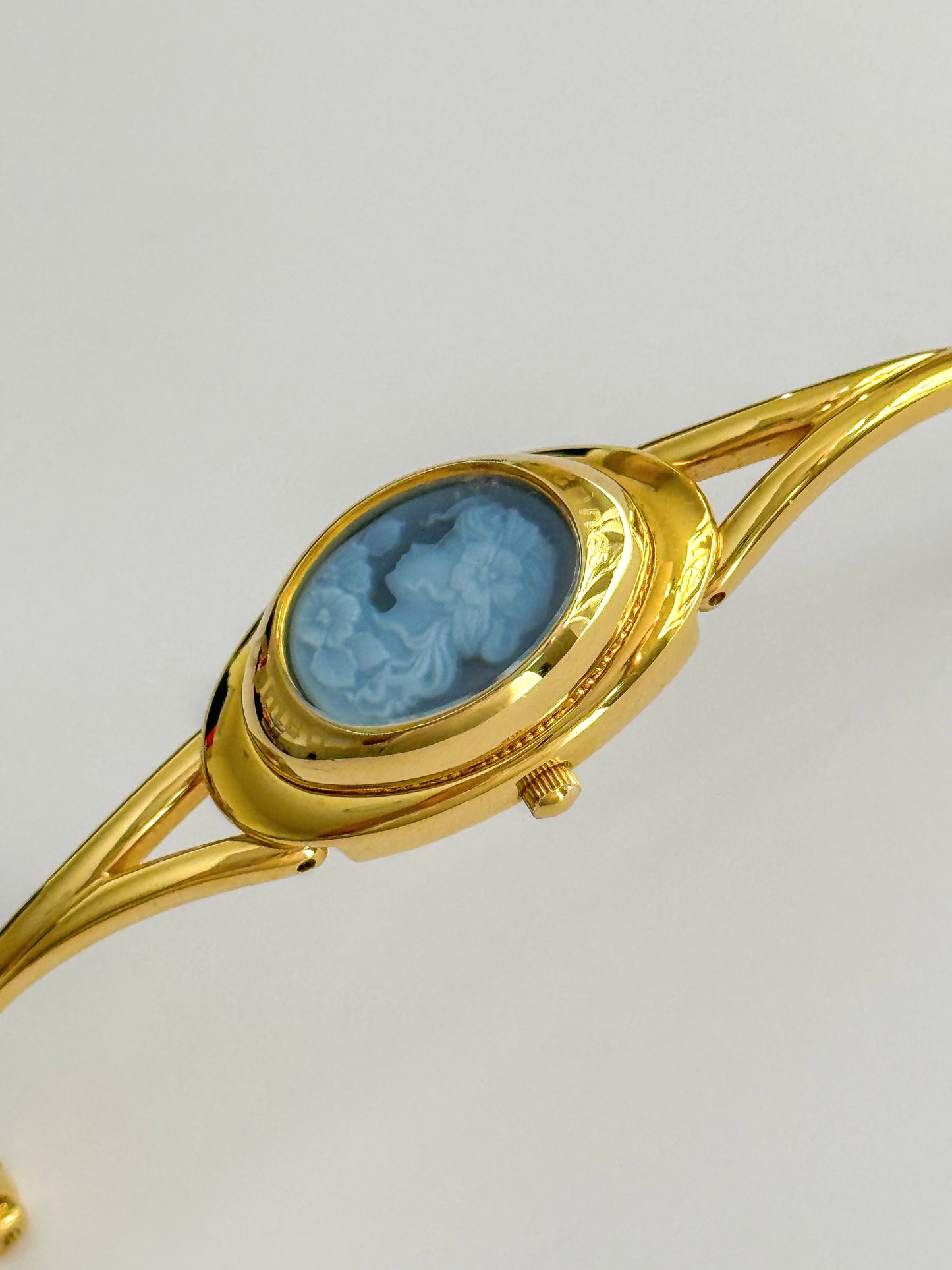 Rare Vintage Gold Tone Bangle Watch With A Blue Cameo Peekaboo Dial