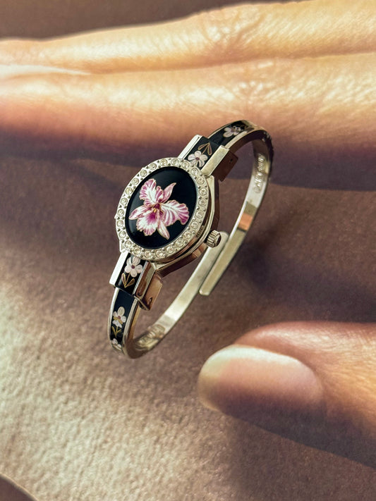 Vintage Silver Tone André Mouche Peekaboo Cuff Watch With a Black Enamel Purple Hibiscus Flower Design and Crystal Bezel