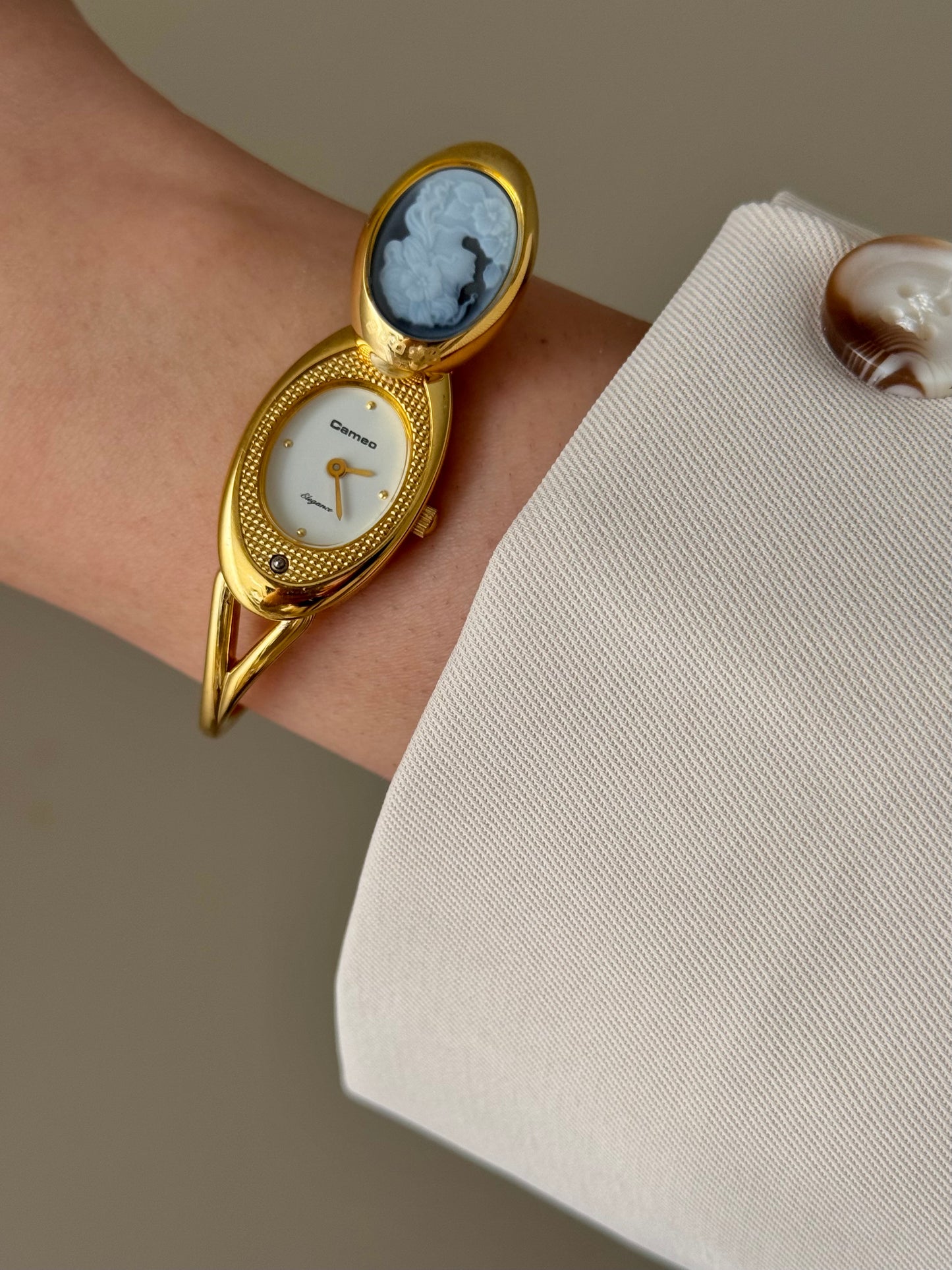 Rare Vintage Gold Tone Bangle Watch With A Blue Cameo Peekaboo Dial