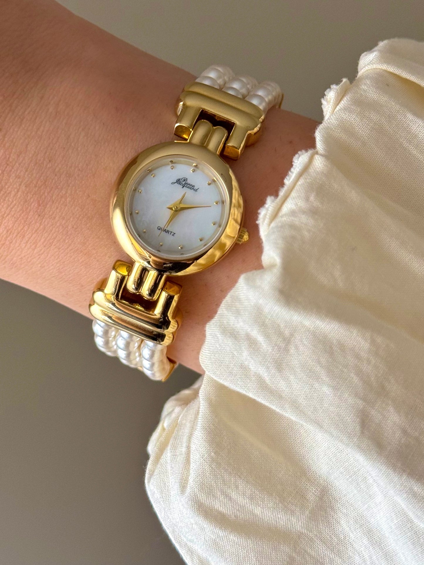 Vintage Pierre Jacquard Gold Watch With Pearl Band and Round Mother Of Pearl Case