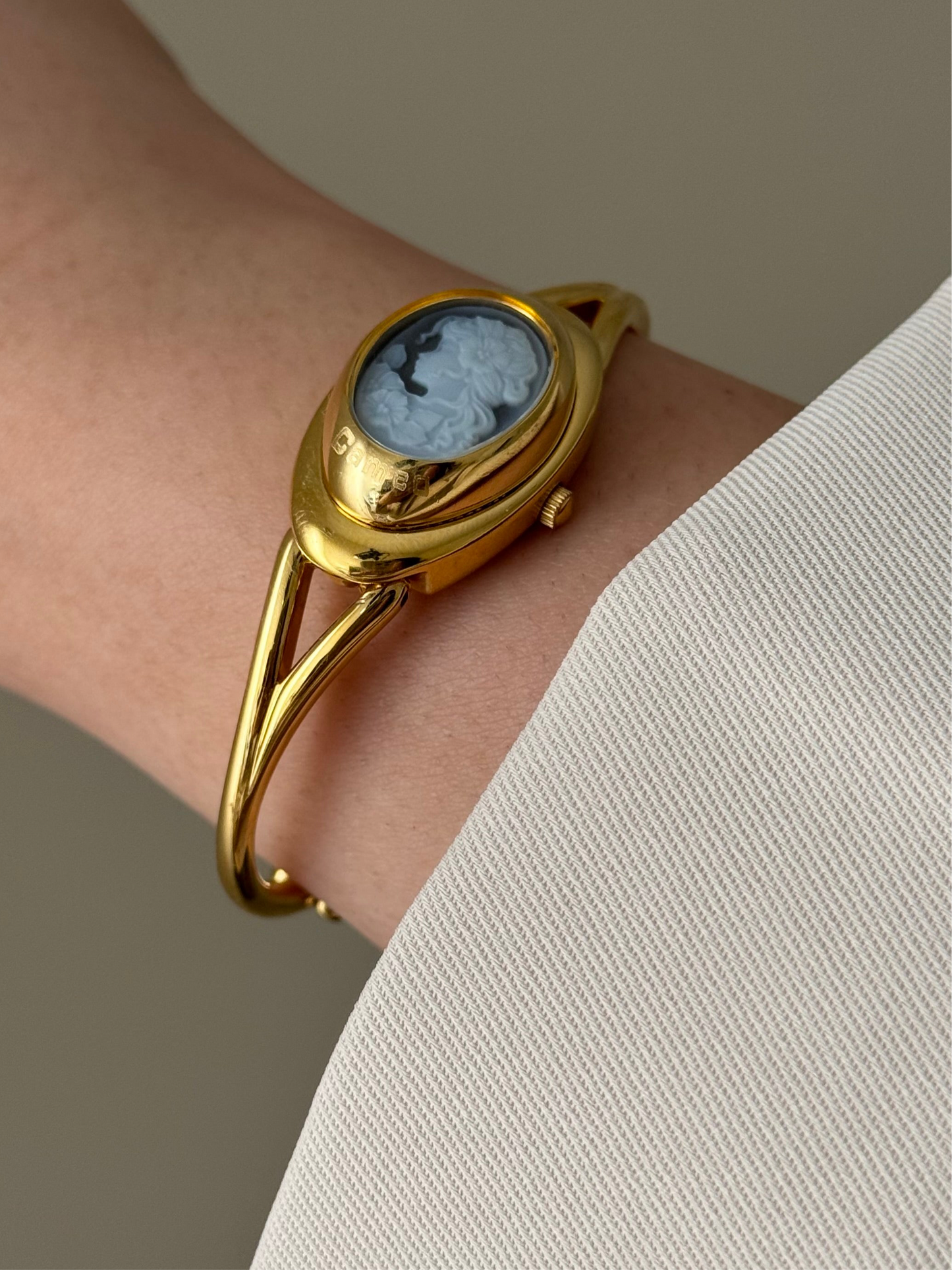 Rare Vintage Gold Tone Bangle Watch With A Blue Cameo Peekaboo Dial