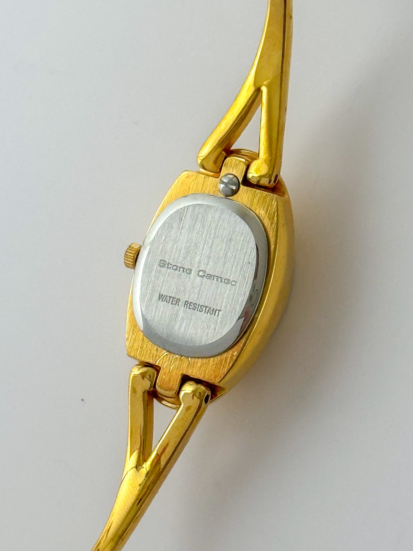 Rare Vintage Gold Tone Bangle Watch With A Blue Cameo Peekaboo Dial