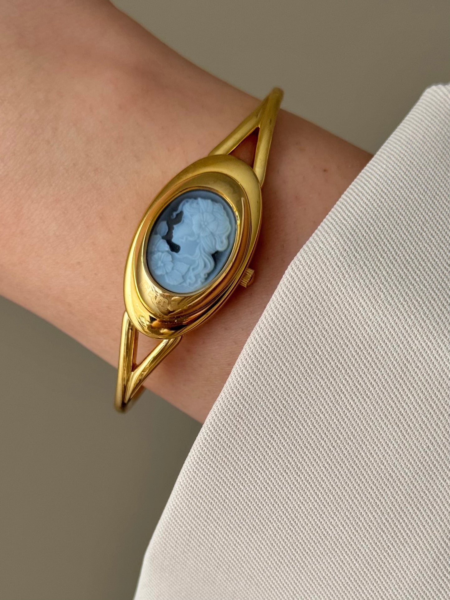 Rare Vintage Gold Tone Bangle Watch With A Blue Cameo Peekaboo Dial