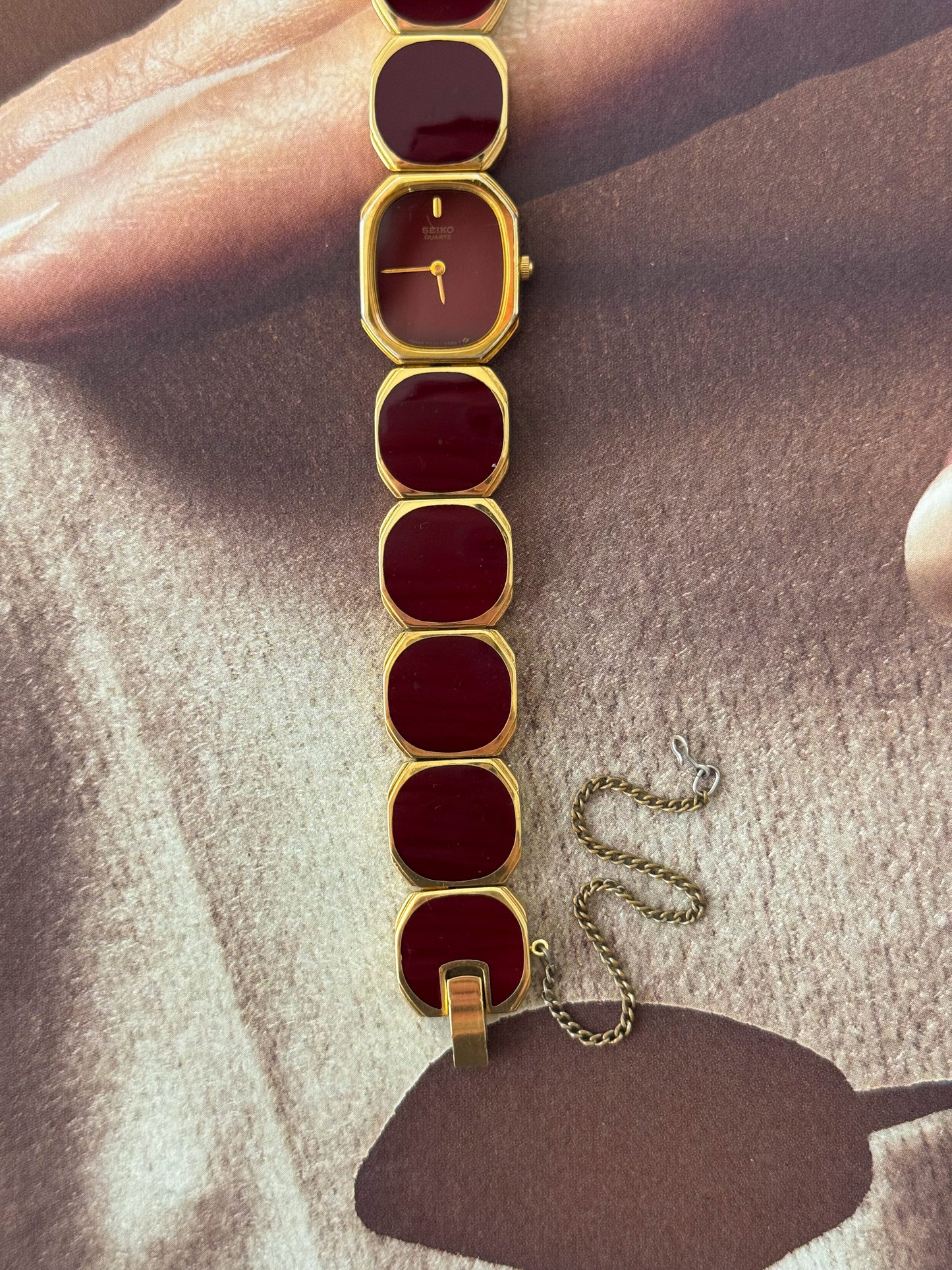 Extremely Rare and Gorgeous Seiko Watch With Deep Burgundy Tone Enamel and Gold Accents.
