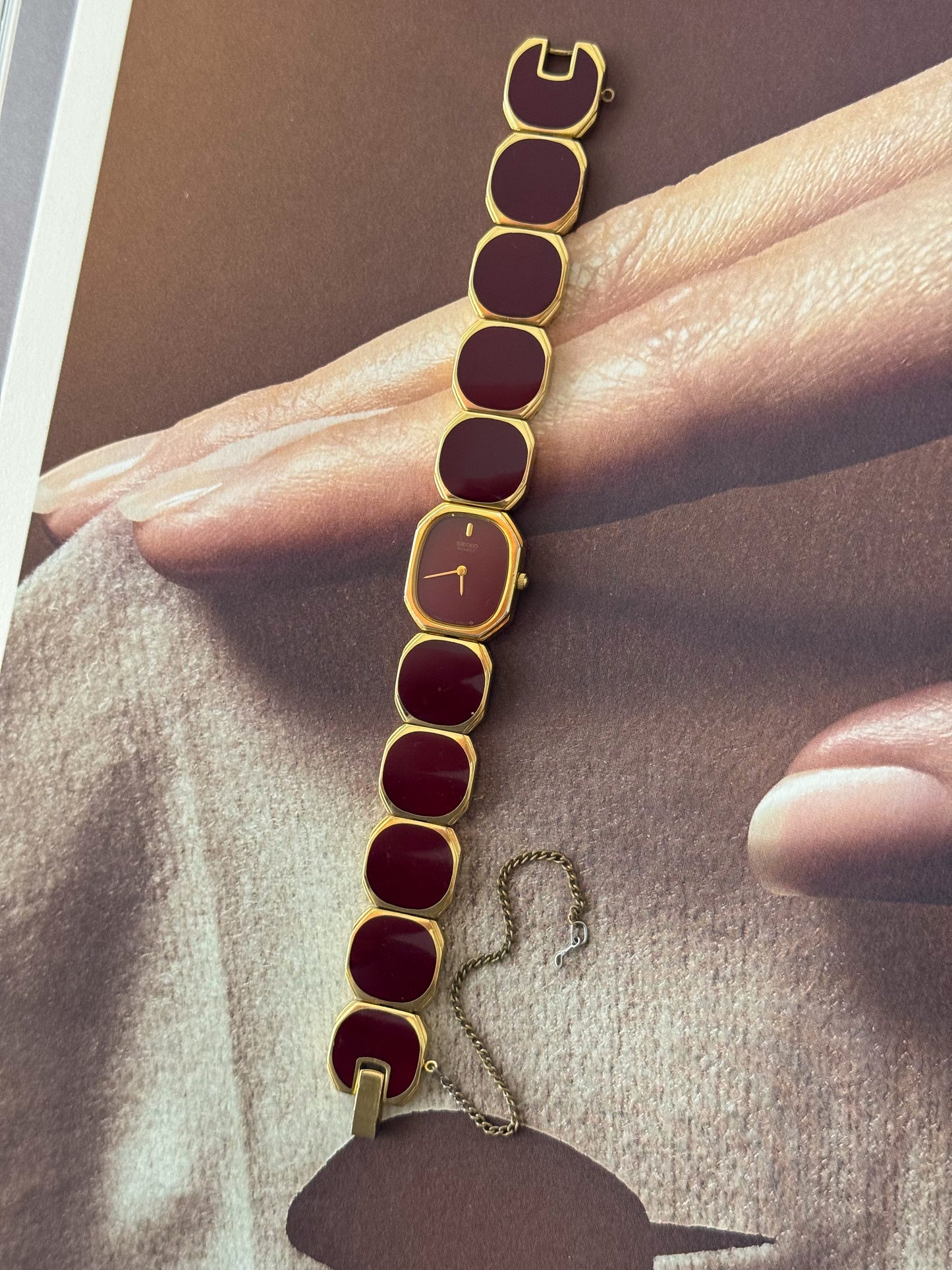 Extremely Rare and Gorgeous Seiko Watch With Deep Burgundy Tone Enamel and Gold Accents.