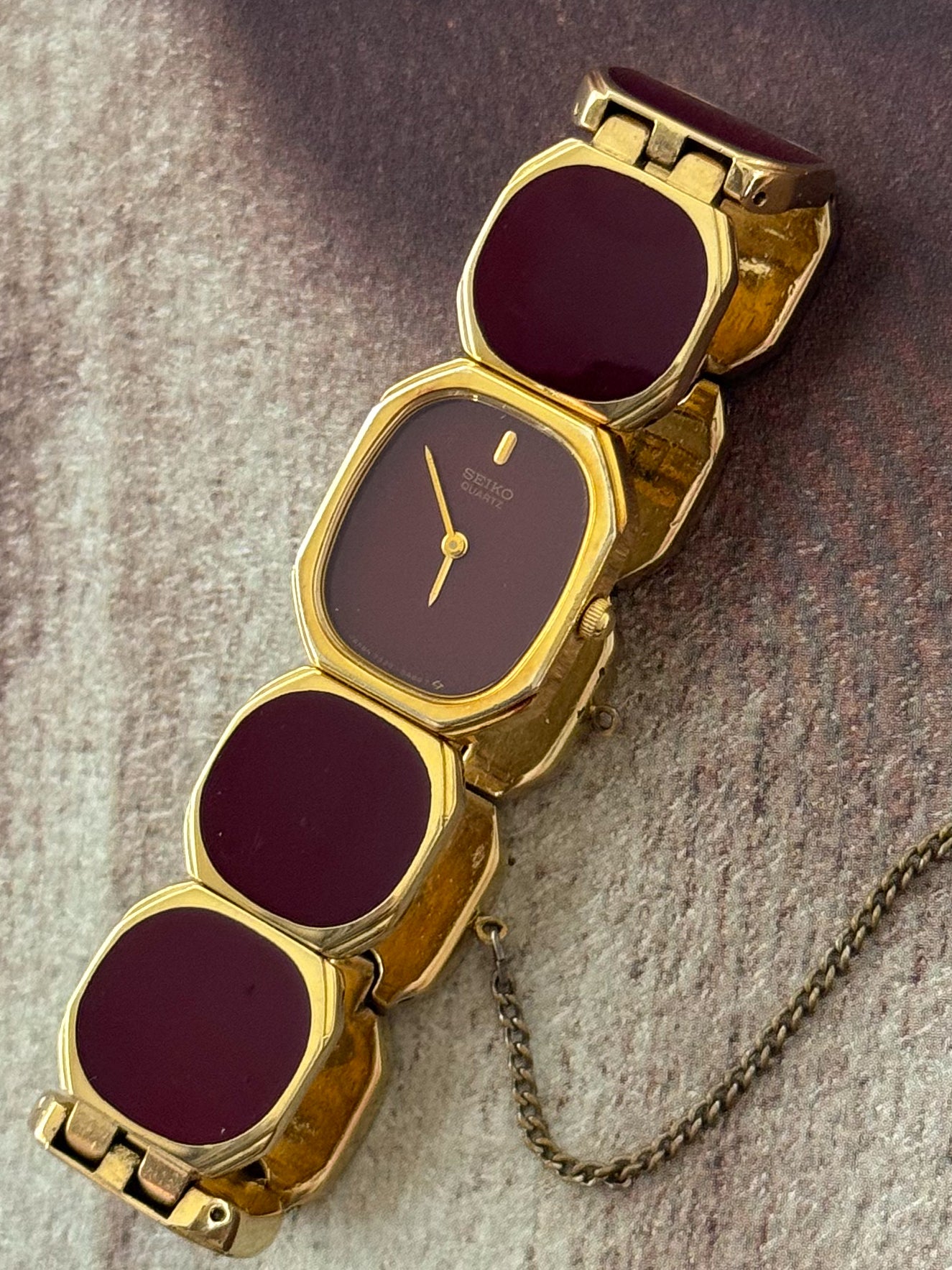 Extremely Rare and Gorgeous Seiko Watch With Deep Burgundy Tone Enamel and Gold Accents.