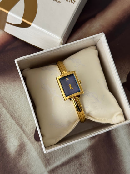 Vintage 90s Gold Tone Yves Saint Laurent (YSL) Bangle Watch With Blue Square Dial