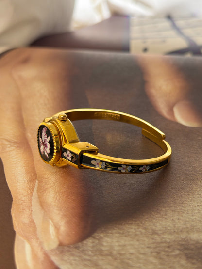 Vintage Gold Tone Andre Mouche Peekaboo Cuff Watch With Black and Purple Peony Enamel Flower Design