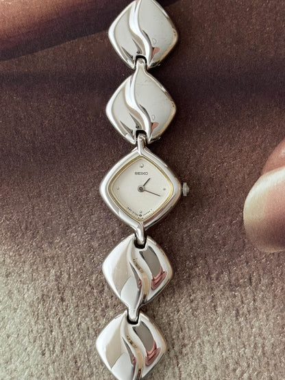 Vintage Silver Seiko Watch With Diamond Shaped Case and Polished Band