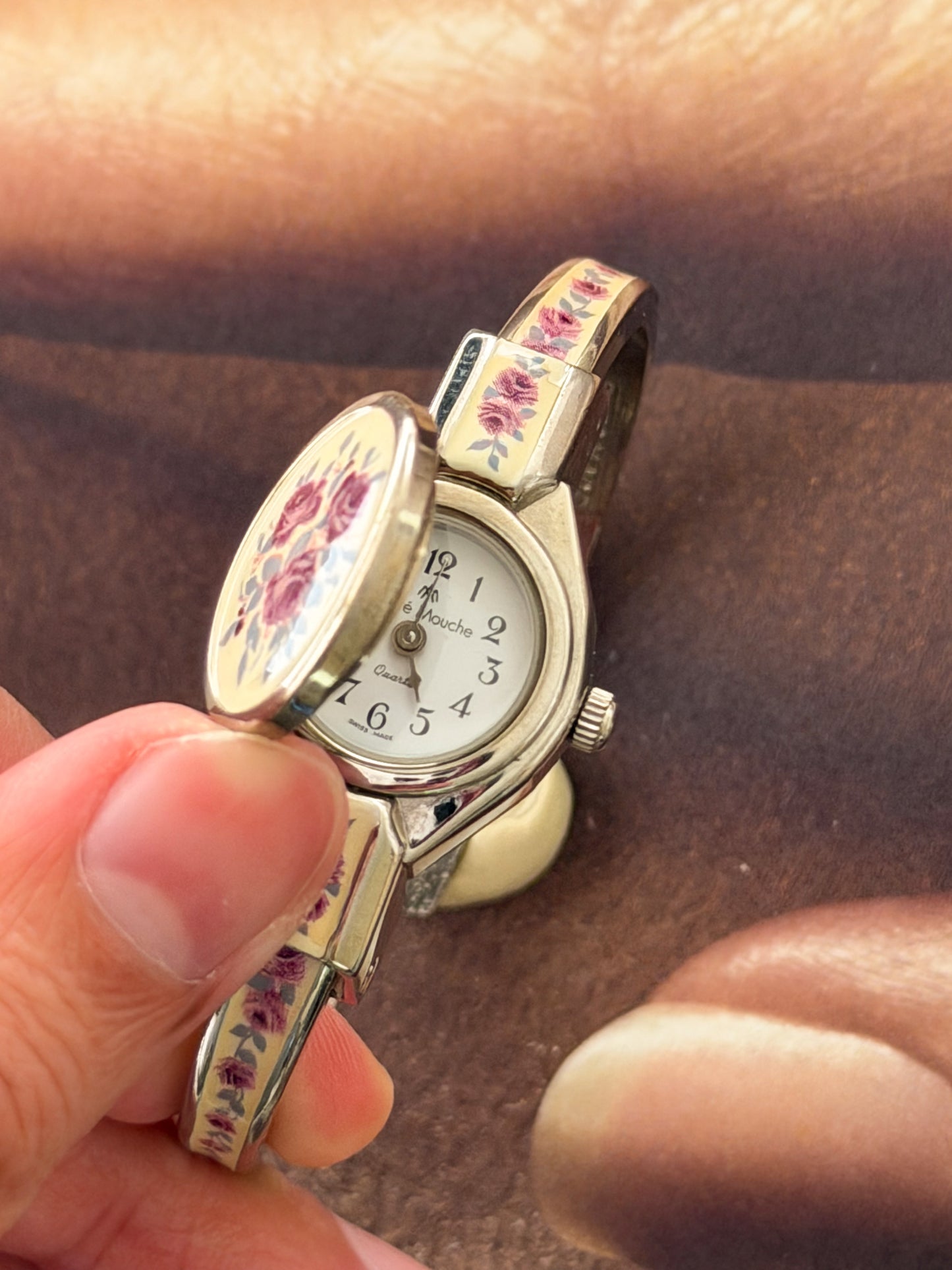 Vintage Silver Tone André Mouche Peekaboo Cuff Watch With White Enamel and Pink Rose Design