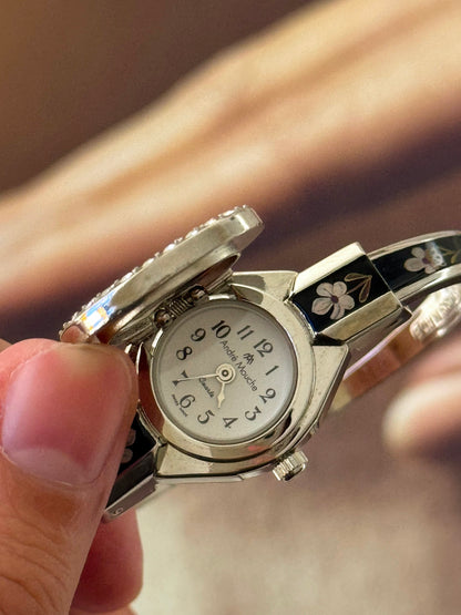 Vintage Silver Tone André Mouche Peekaboo Cuff Watch With a Black Enamel Purple Hibiscus Flower Design and Crystal Bezel