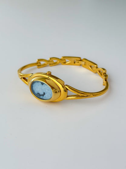 Rare Vintage Gold Tone Bangle Watch With A Blue Cameo Peekaboo Dial