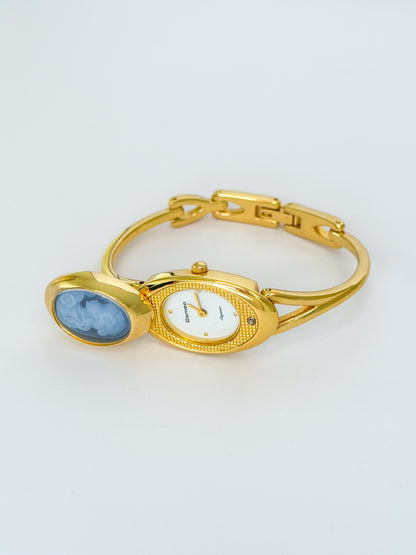 Rare Vintage Gold Tone Bangle Watch With A Blue Cameo Peekaboo Dial