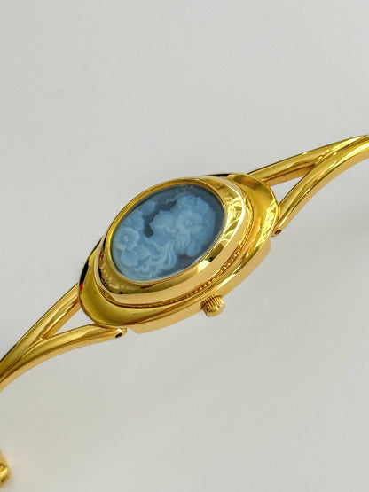 Rare Vintage Gold Tone Bangle Watch With A Blue Cameo Peekaboo Dial