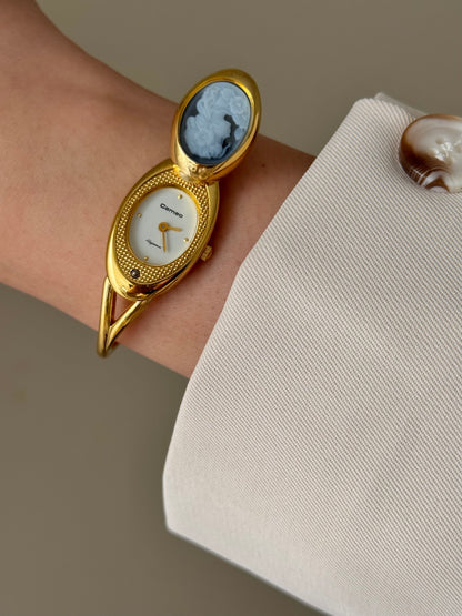 Rare Vintage Gold Tone Bangle Watch With A Blue Cameo Peekaboo Dial