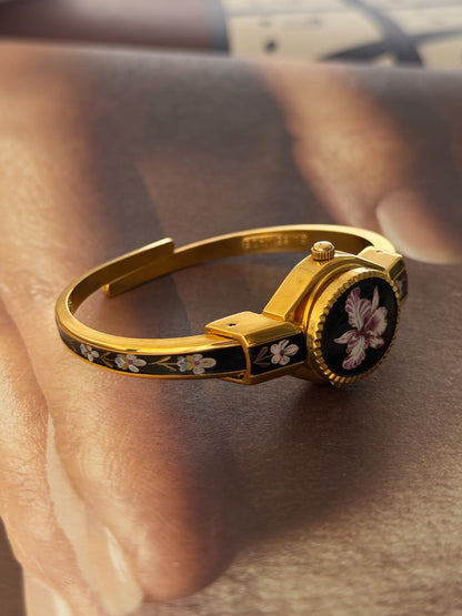 Vintage Gold Tone Andre Mouche Peekaboo Cuff Watch With Black and Purple Peony Enamel Flower Design