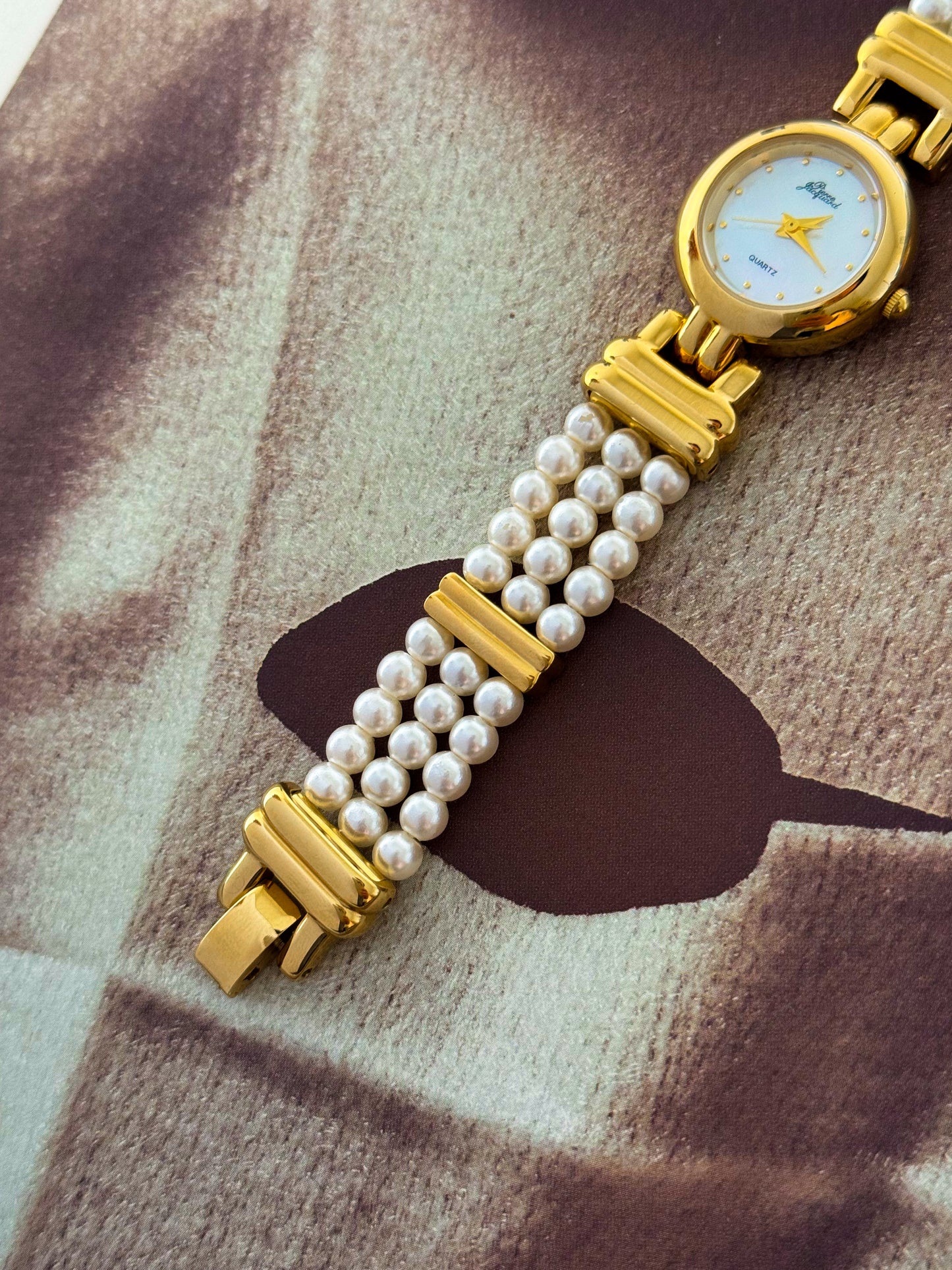 Vintage Pierre Jacquard Gold Watch With Pearl Band and Round Mother Of Pearl Case
