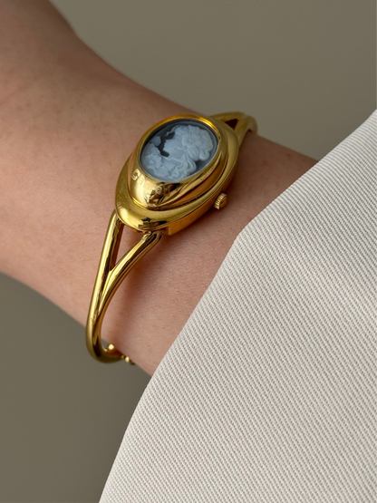 Rare Vintage Gold Tone Bangle Watch With A Blue Cameo Peekaboo Dial
