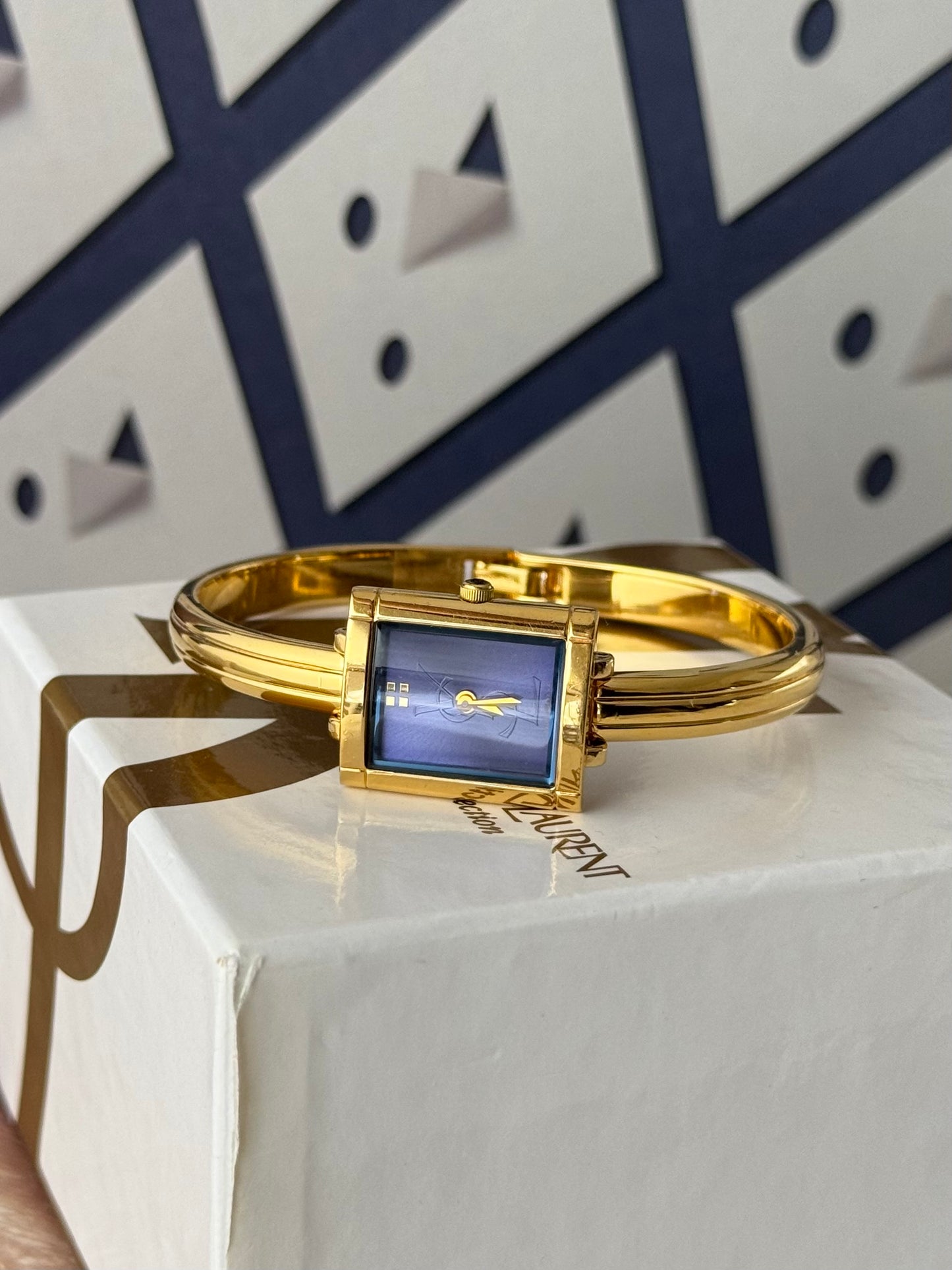 Vintage 90s Gold Tone Yves Saint Laurent (YSL) Bangle Watch With Blue Square Dial