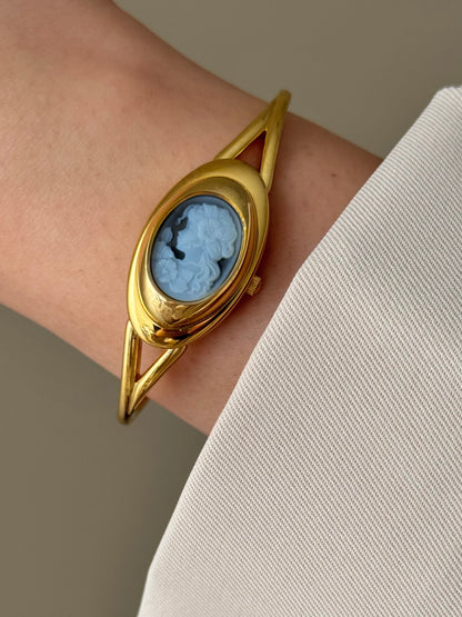 Rare Vintage Gold Tone Bangle Watch With A Blue Cameo Peekaboo Dial