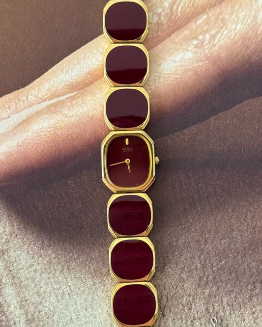 Extremely Rare and Gorgeous Seiko Watch With Deep Burgundy Tone Enamel and Gold Accents.